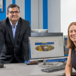 Mohsin Siddiqui and Jenny Saxe collaborate in a computer lab.